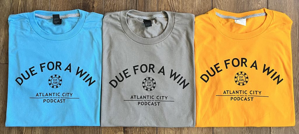 Due For A Win t-shirts side by side in blue, gray, and gold.